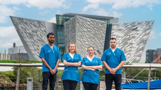 Four Leadcare Agency Nurses standing outside Titanic Museum in Belfast in their blue Leadcare Uniform.