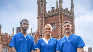 Three Leadcare Nurses standing in Nursing uniform outside Queen University building Belfast, starting their nursing career